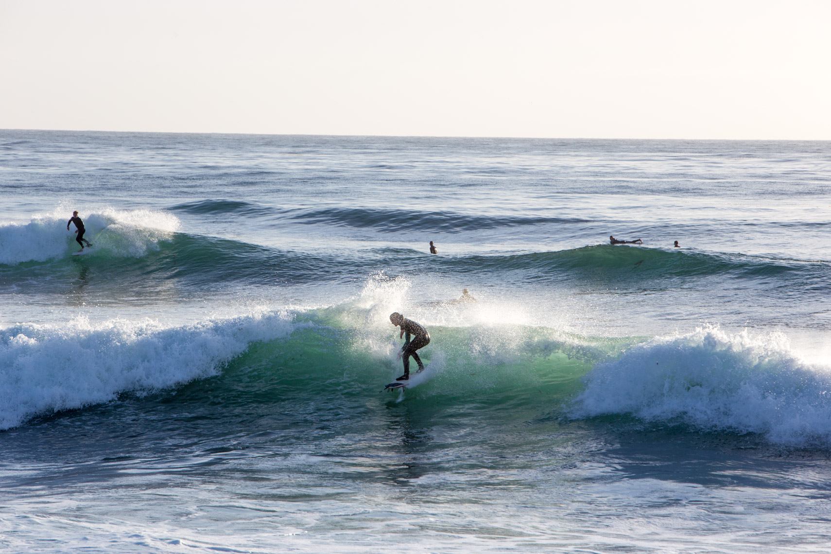 Surfers riding huge ocean waves