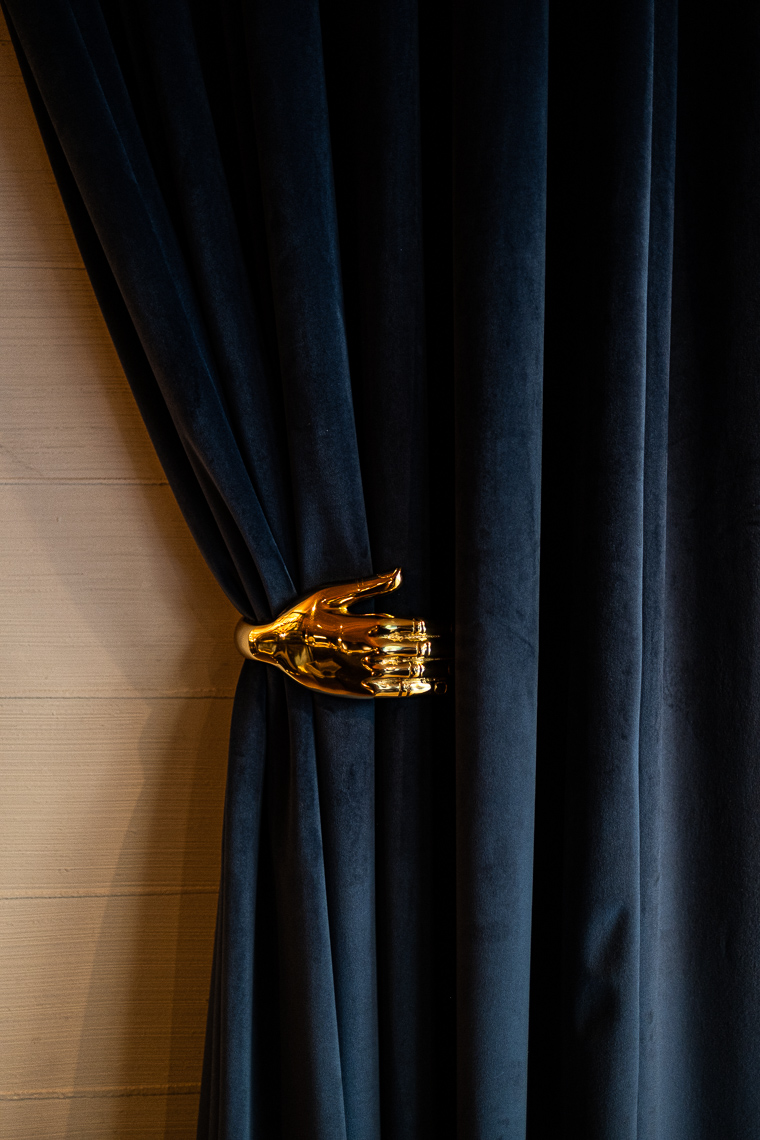 Detail of brass curtain holder
