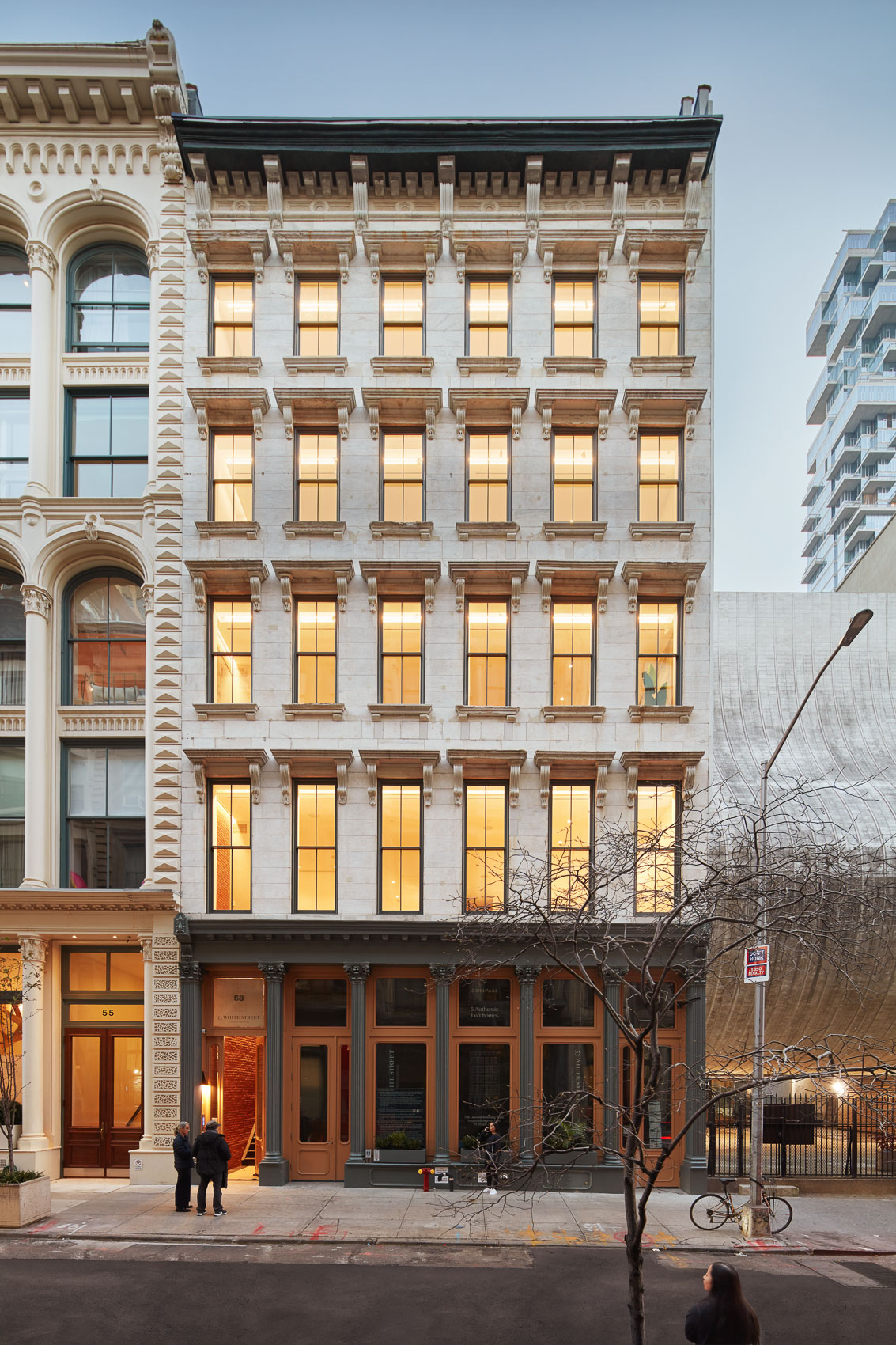 Front elevation view of pre-war multistory building in SoHo New York City at dusk