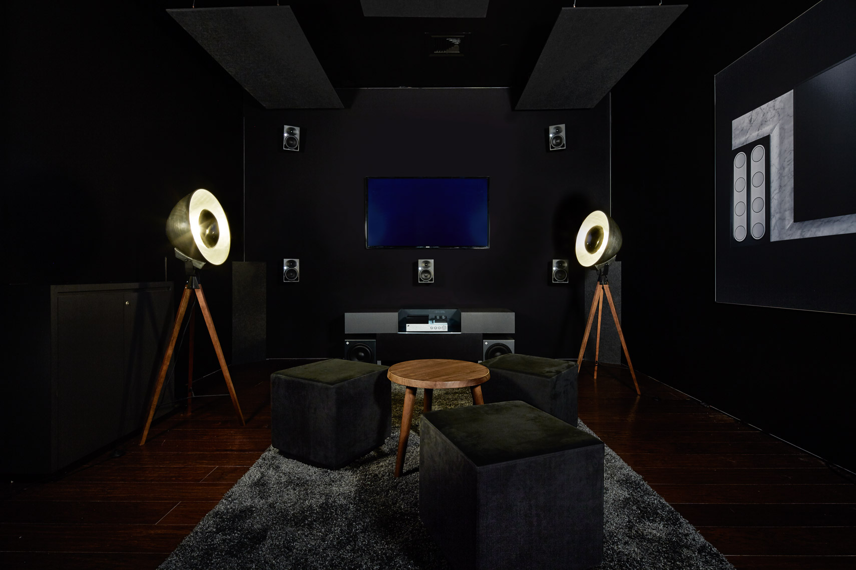 Dark interiors of audio experience room with high end audio equipment