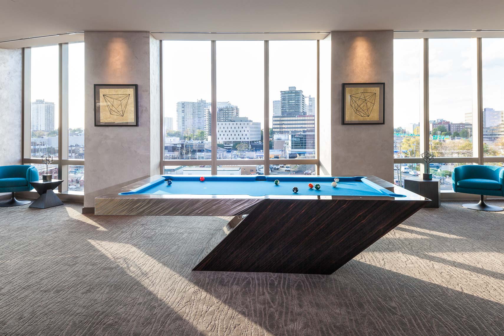A custom pool table in the common area of a residential luxury apartment building
